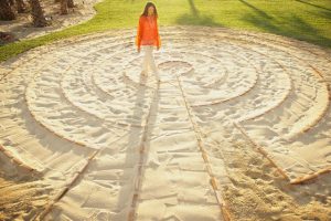 Woman walking in a meditation labyrinth